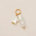 Exquisite macro detail showing a white star shell and baroque pearl on a golden ring - Star Long Pearl Pendant / Gold/White