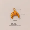 Close-up of a realistic orange croissant charm pendant with detailed dimensions and weight - Croissant Shape