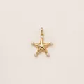 Detailed macro view of an 18K gold plated starfish pendant featuring five small pearls. - Starfish Pendant