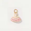 Detailed macro shot of a pink ballet dress pendant featuring a centered pearl and gold plating. - Tutu Pendant