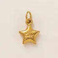 Macro detail of star-shaped 18K gold plated stainless steel pendant with Love engraving. - Love