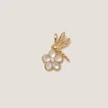 Macro detail of an 18K gold plated dragonfly and mother-of-pearl flower pendant charm - Flower Pendant
