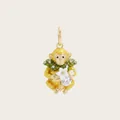 Detailed macro view of an enamel golden monkey pendant with white flower and crystal - Monkey Pendant