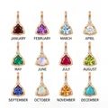 Detailed view of twelve colorful triangular birthstone pendants in gold plated stainless steel - January Birthstone Pendant (MQPK262601SI)