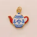 Detailed close-up of a charming red and blue floral enamel teapot pendant charm. - Teapot Shaped Pendant Only