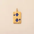 Detailed close-up of a gold-plated stainless steel King of Diamonds pendant with blue stones. - Diamond K Poker Card Pendant / Gold