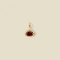 Close-up of elegant oval ruby pendant with 18K gold plating and small sparkling accent stone - Dark Red Oval Gemstone / January Style Gold