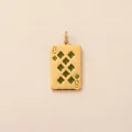Close-up detail of a 18K gold plated 8 of Diamonds playing card pendant with green stones. - Diamond 8 Poker Card Pendant / Gold