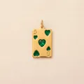 Detailed view of gold-plated poker card pendant with green heart stones - Heart 5 Poker Card Pendant / Gold