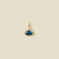 Detailed view of an oval blue gemstone pendant set in 18K gold plated stainless steel - Blue Faceted Gemstone / September Style Gold