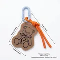 Cute brown bear bag charm with vibrant orange rope and light blue plastic clasp - Bear Charm