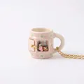 Exquisite detail of the knitting girl miniature scene inside a ceramic mug pendant necklace. - Pink Flower Knitting Girl Mug Style