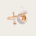 Close-up detail of healing miniature opening rabbit cake ring with carrot charm inside - Ring / Blue