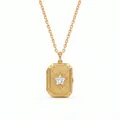 Detailed view of gold rectangular locket with starburst engraving and crystal star. - Rectangular Star Locket