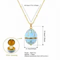 Elegant blue enamel egg locket necklace with daisy flower detail, gold plated copper - April Flower (HSNK255219KI)