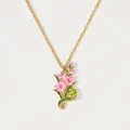 Detailed view of the gold flower pendant necklace with pink enamel and a green gemstone. - August Gladiola