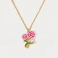 Close-up detail of gold-tone necklace with pink enamel roses and a moonstone accent - June Rose