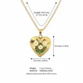 Close-up of stainless steel heart locket necklace with daisy flower and size dimensions - April Birth Flower Locket Necklace / Gold