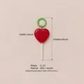 Red heart lollipop bag charm with green ring and detailed size specifications. - Heart Lollipop