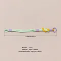 Handmade woven fabric and alloy bag charm in pastel green, yellow and purple colors - Green Braided Rope