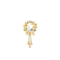 Close-up of a charming floral wreath pendant featuring a swan design and yellow bow accents - March Flower Pendant