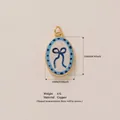 Nordic style oval copper pendant featuring a blue bow pattern with 18K gold finish - Blue Bow Pendant