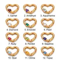 Detailed view of 12 golden heart-shaped birthstone pendants with various gemstone inlays - January Birthstone Pendant