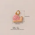 Cute pink and cream snail pendant in gold-plated copper finish with 10mm dimensions - Snail Pendant