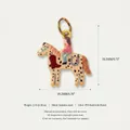Macro detail of the 19.2mm horse and rider charm in PVD gold plated stainless steel. - Horse Pendant Style 14