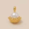 Macro view of a gold ice cream cone pearl pendant for DIY jewelry making accessories - Wavy Edge Cone Pendant