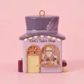 Detailed view of a purple ceramic Owl's Tailor Shop fairy house pendant ornament - Owl's Tailor Shop Pendant