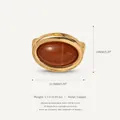 Macro view of oval brown stone pendant in copper frame with dimensions 10x12.6mm - Oval Pendant Style