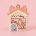 Detail view of a cute fairy tale house pendant featuring a cat's bakery design for DIY - Cat's Bakery Pendant