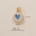 Round copper pendant featuring a blue heart design, measuring 15x12mm with 3.7g weight. - Blue Heart Disc Pendant (9 Blue Heart)