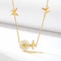 Detailed view of the gold-plated necklace featuring a daisy pendant and butterflies - April