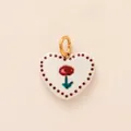 Charming white enamel heart pendant featuring a red tulip design and a gold-tone bail - Heart Flower Pendant