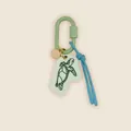 Detail view of retro hand-drawn sea turtle charm on light green carabiner and blue cord - Warm Orange Salmon Painted Style