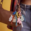 Close-up of colorful acrylic animal keychains including sheep and hamster on a bag - Mixed Animal Charm Collection
