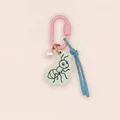 Close-up of a cute acrylic ant bag charm featuring a pink clasp and blue cord detail - Ant Charm