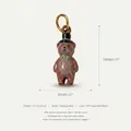 Close-up detail of a miniature brown teddy bear charm with dimensions and material info. - Dr. Bear Pendant