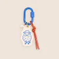 Detail of cute sheep acrylic charm featuring a blue carabiner and orange knotted rope - Little Sheep Charm