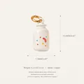 Detailed view of a white cartoon bottle copper charm for DIY jewelry necklace and bracelet - 9 Milk Bottle