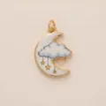 Macro detail of a delicate gold-tone crescent moon and cloud enamel pendant for DIY jewelry - Cloud Moon Pendant