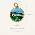 Detail showing cartoon house landscape enamel pendant with gold-toned twisted edge - White House Scene