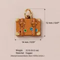 Close-up of vintage copper suitcase charm showing dimensions 14mm by 12mm and weight - No.2 Bag Pendant