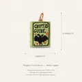 Detailed view of a green copper cryptid guide book pendant with mothman illustration - Cryptid Guide Book