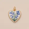 Detailed macro shot of heart-shaped gold pendant with bluebells and butterfly design - Butterfly Heart Pendant