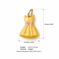 Detail view of yellow floral dress charm showing dimensions 16mm x 12.8mm and copper material. - Yellow Dress Charm