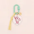 Detailed shot of a cartoon character acrylic keychain with a mint green carabiner clip - Cartoon Backpack Figure