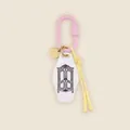 Detail view of a minimalist keychain with pink carabiner and wardrobe pendant - Pink/White/Gold/Yellow